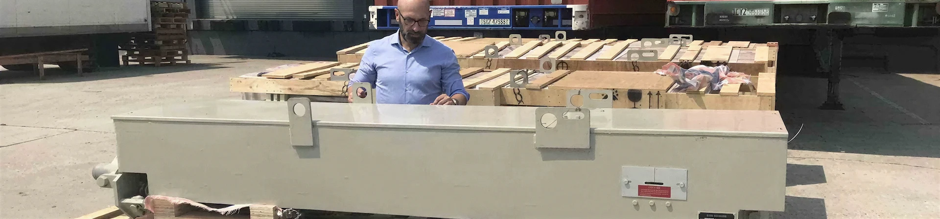 Man inspecting new sootblower upon delivery.